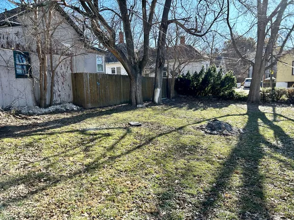 a backyard of a house with trees and outdoor space
