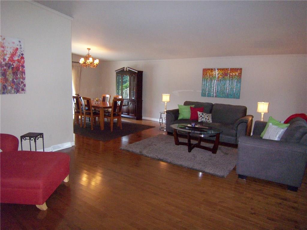 1755 Partridge Run Road Pittsburgh, PA 15241 - Photo 6 of 25 Don't you just love the open flow? And enjoy newer maple hardwood flooring in formal living and dining areas. Again, vaulted ceilings increase the feeling of space.