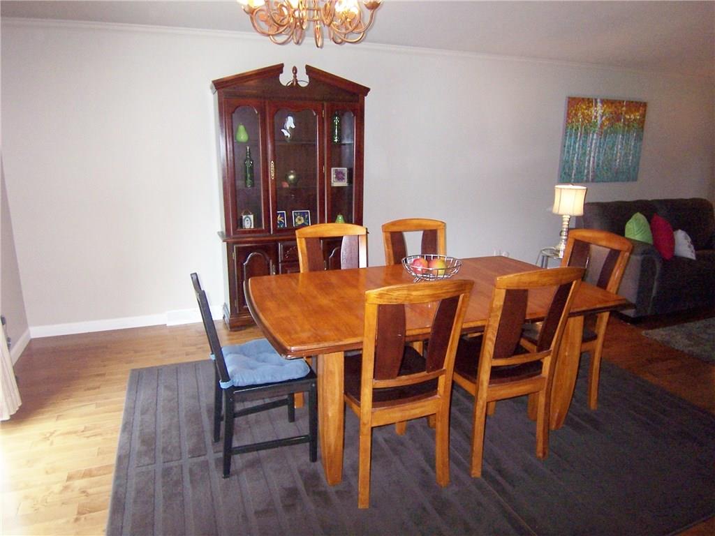 1755 Partridge Run Road Pittsburgh, PA 15241 - Photo 9 of 25 Formal dining area can expand into the living room for large gatherings, and another sliding door to the rear deck lets in lots of light.