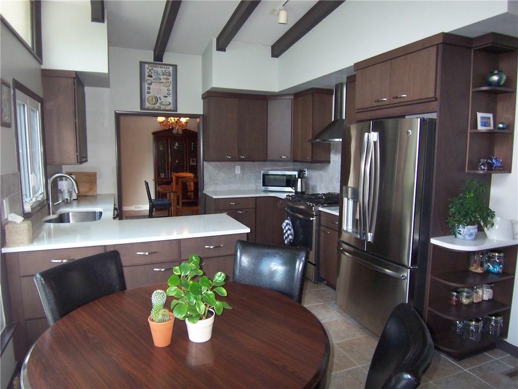 1755 Partridge Run Road Pittsburgh, PA 15241 - Photo 10 of 25 Gourmet cook's delight! Kitchen fully updated a couple of years ago, with all stainless appliances, quartz countertops and new cabinetry befitting the mid-century modern look.