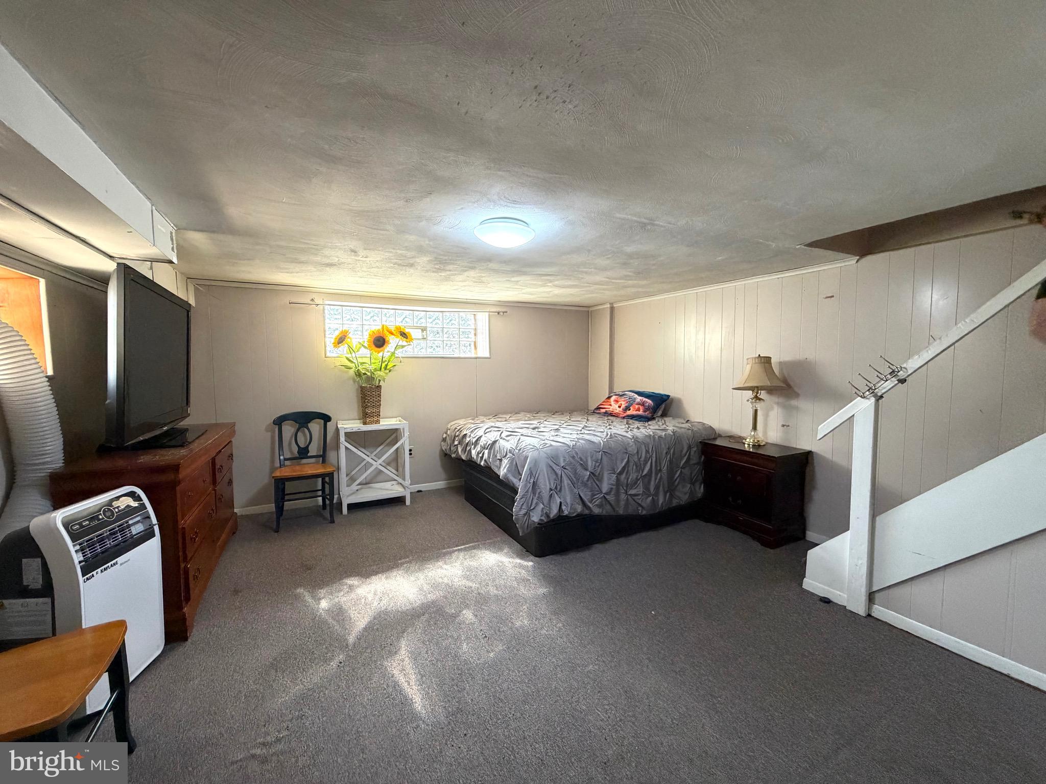 2019 Faunce Street Philadelphia, PA 19152 - Photo 8 of 10 a bedroom with furniture and a flat screen tv