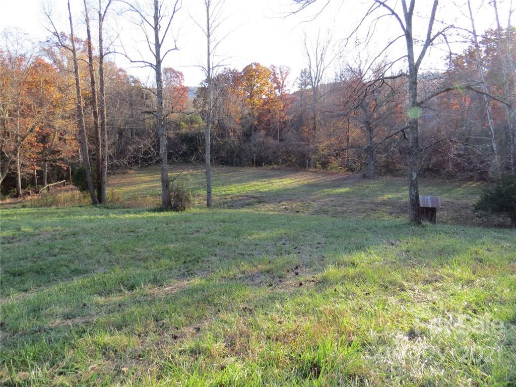 926 Coolbrook Road Union Grove, NC 28689 - Photo 14 of 48 a view of a tiny house with a backyard