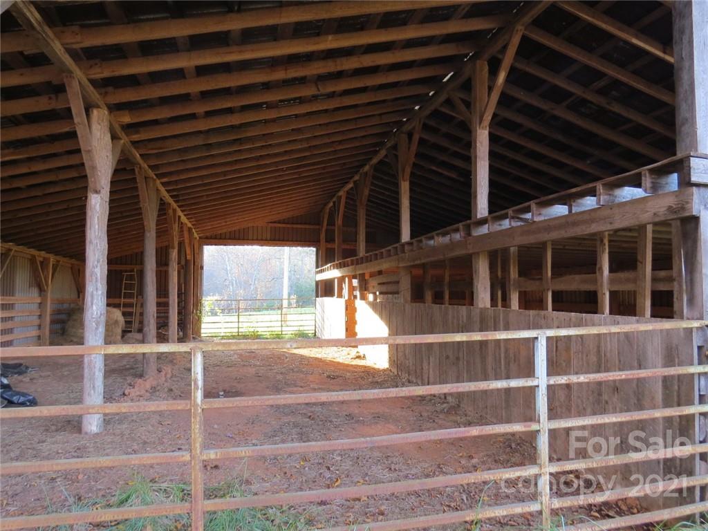 926 Coolbrook Road Union Grove, NC 28689 - Photo 28 of 48 a view of an empty room with wooden floor and windows