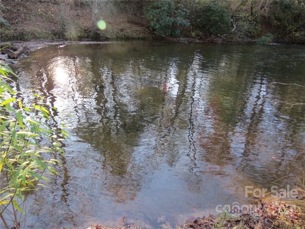 926 Coolbrook Road Union Grove, NC 28689 - Photo 36 of 48 a view of a lake with a yard