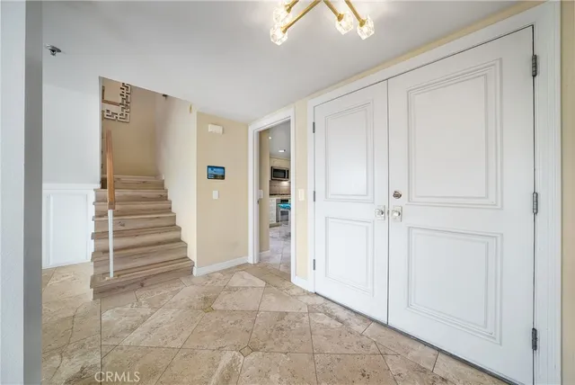a view of a hallway with closet and entryway