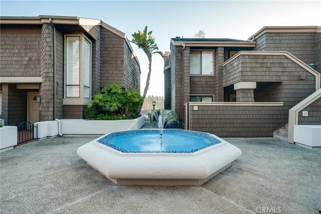 a view of a house with pool and yard