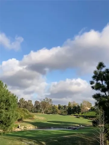 a view of a swimming pool and a yard