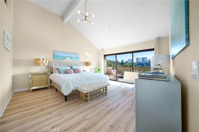 a spacious bedroom with a bed and a large window