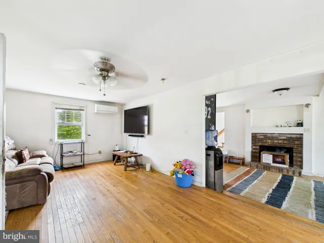 a bed room with furniture and a flat screen tv