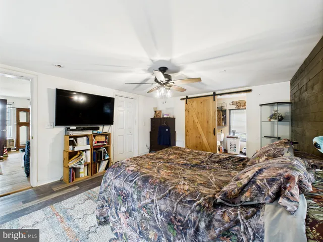 a bathroom with a toilet a sink and a shower curtain
