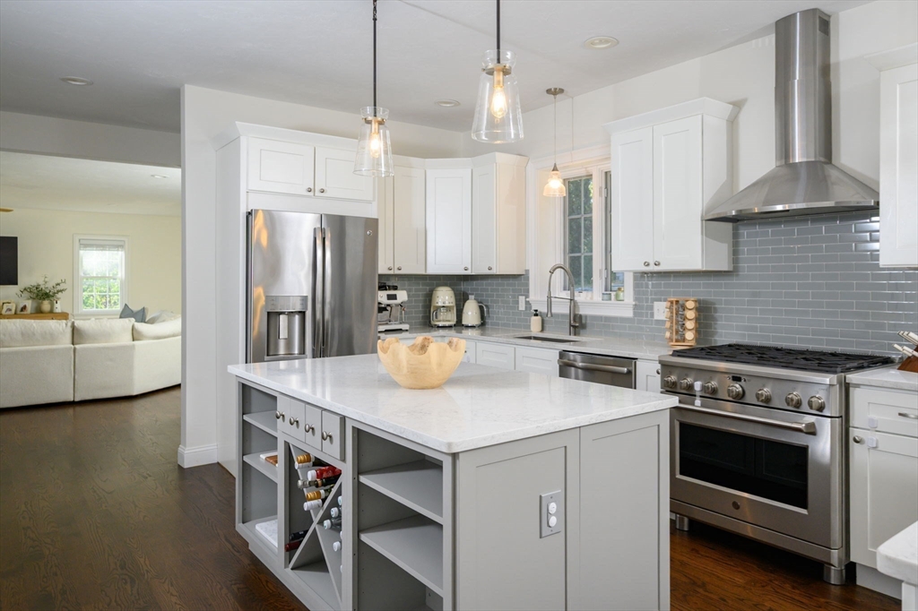 455 Broadway Hanover, MA 02339 - Photo 14 of 42 a kitchen with a stove a sink and a refrigerator