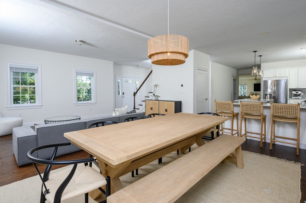 455 Broadway Hanover, MA 02339 - Photo 16 of 42 a living room with stainless steel appliances kitchen island granite countertop furniture a table and chairs