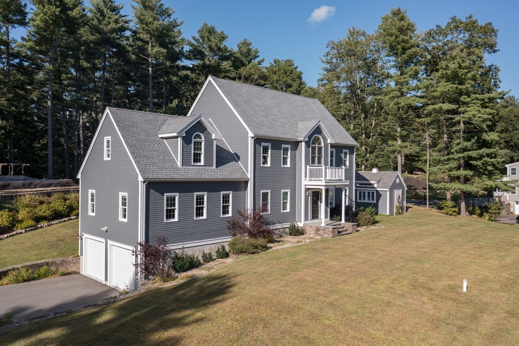 455 Broadway Hanover, MA 02339 - Photo 2 of 42 a front view of a house with a garden