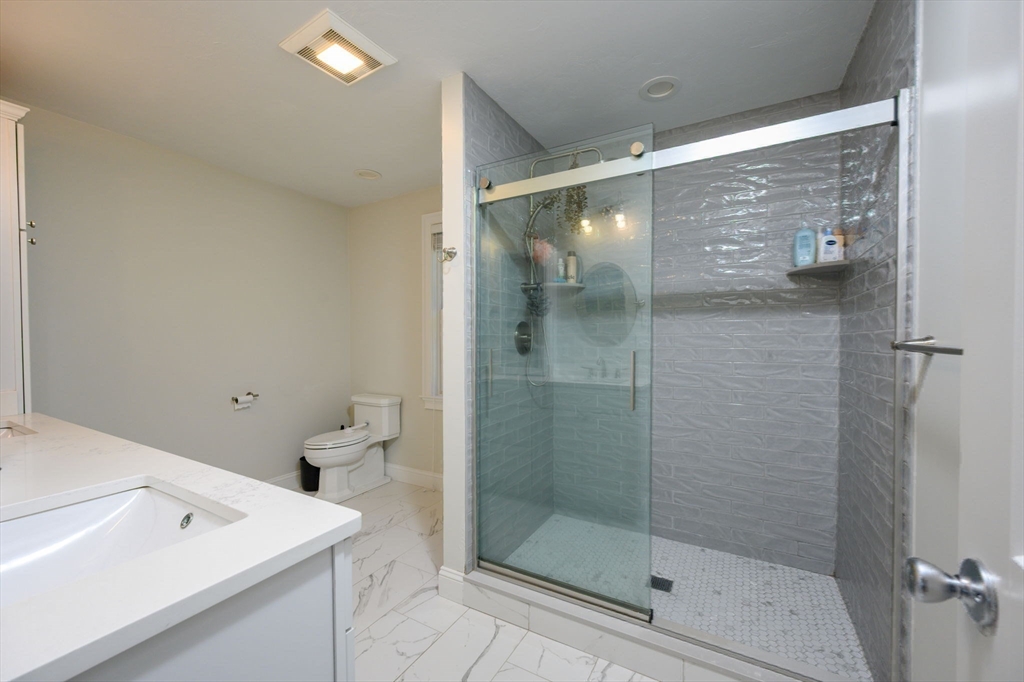 455 Broadway Hanover, MA 02339 - Photo 23 of 42 a bathroom with a shower and sink