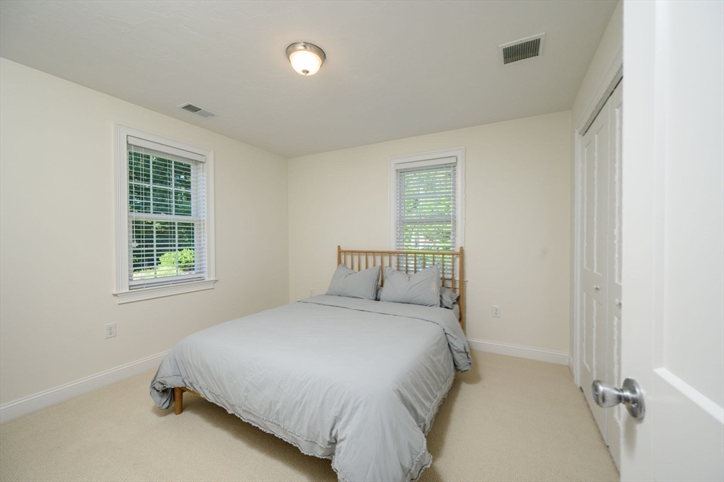 455 Broadway Hanover, MA 02339 - Photo 27 of 42 a bedroom with a bed and a window