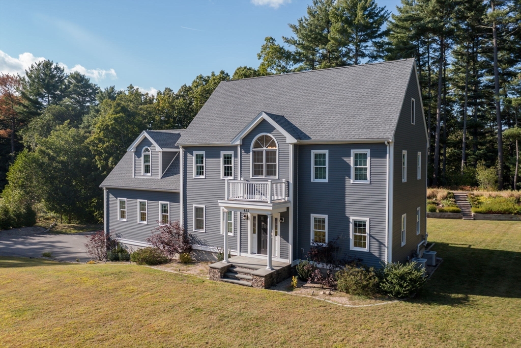 455 Broadway Hanover, MA 02339 - Photo 3 of 42 a front view of a house with a yard