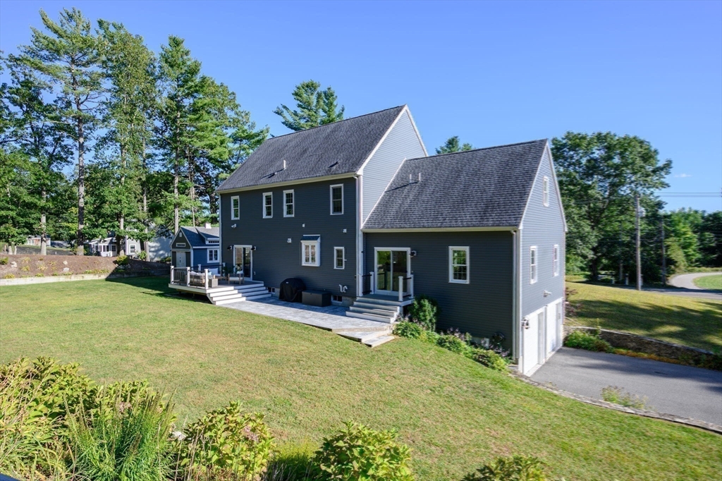 455 Broadway Hanover, MA 02339 - Photo 41 of 42 a view of a house with table and chairs in patio