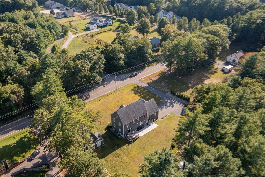 455 Broadway Hanover, MA 02339 - Photo 42 of 42 a view of a house with a yard and a large tree
