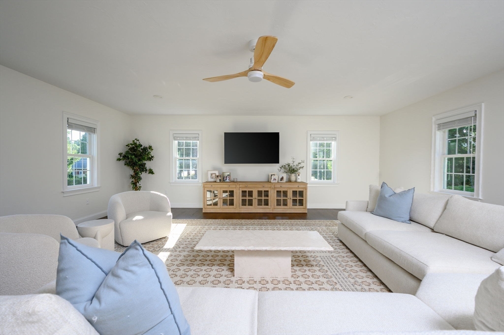 455 Broadway Hanover, MA 02339 - Photo 5 of 42 a living room with furniture and a flat screen tv