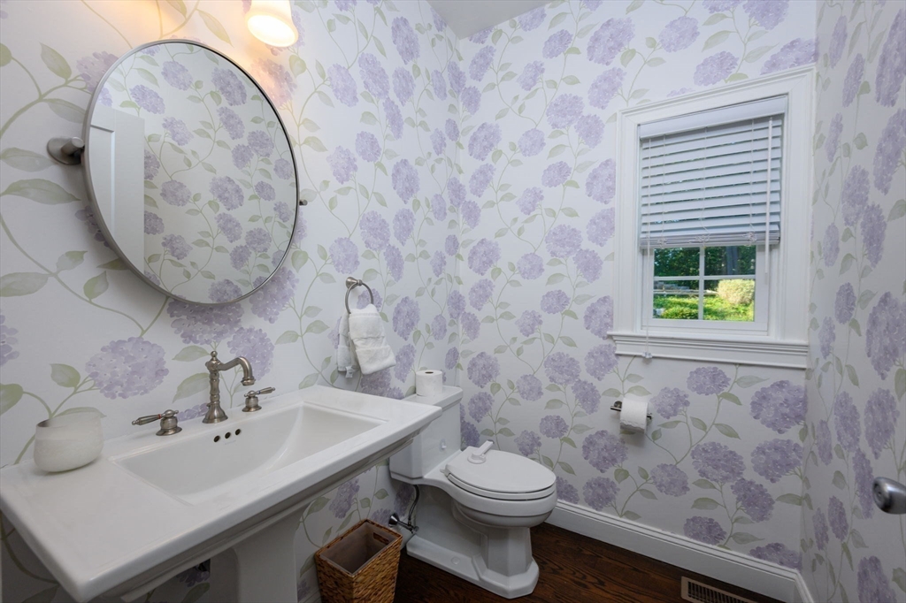 455 Broadway Hanover, MA 02339 - Photo 9 of 42 a bathroom with a sink a toilet and mirror