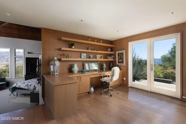 a room with a sink and a mirror