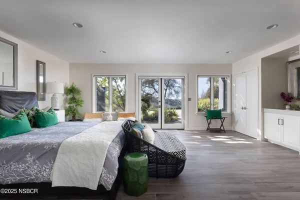 a bedroom with bed and furniture