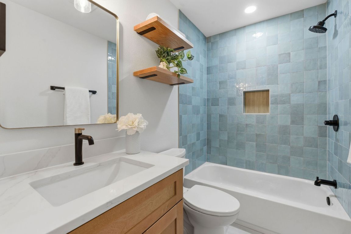 2701 Calabash Cove Austin, TX 78745 - Photo 28 of 40 a bathroom with a sink a toilet and a bathtub