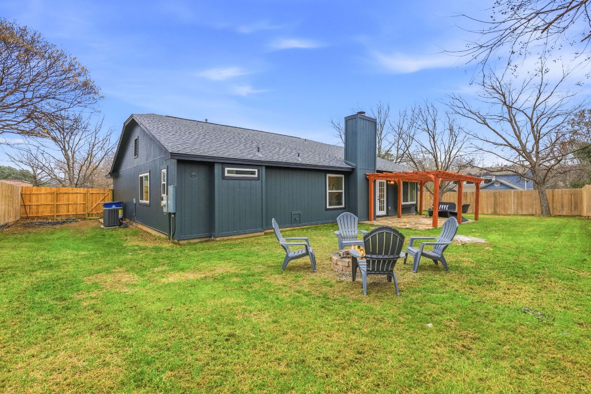 2701 Calabash Cove Austin, TX 78745 - Photo 34 of 40 a backyard of a house with table and chairs