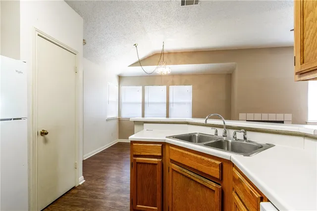 a kitchen that has a sink and a window