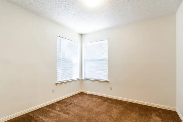 an empty room with a empty space and a window