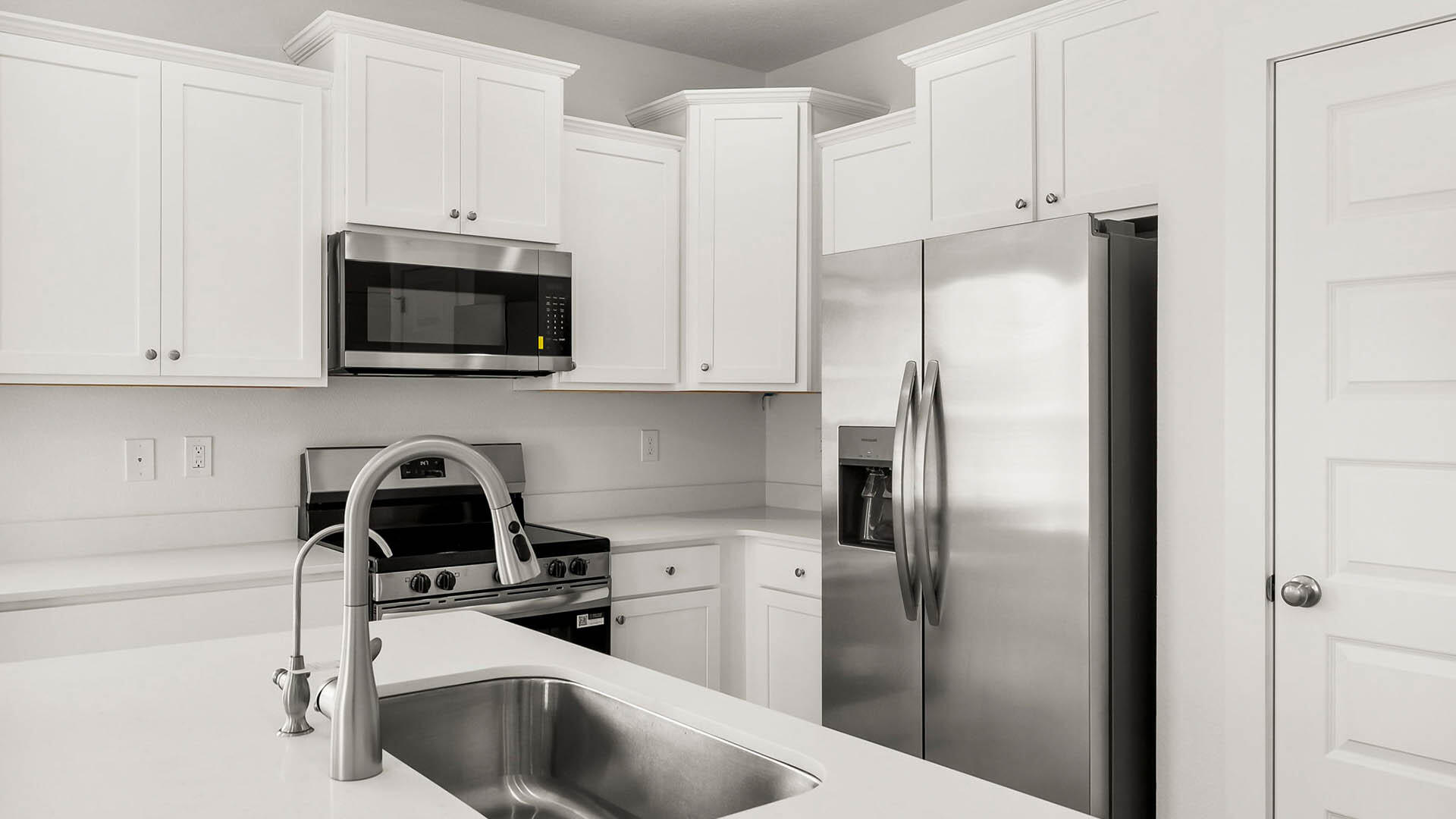 40 Hawk Street Santa Rosa Beach, FL 32459 - Photo 6 of 30 a kitchen with stainless steel appliances a refrigerator a sink a stove a microwave and cabinets