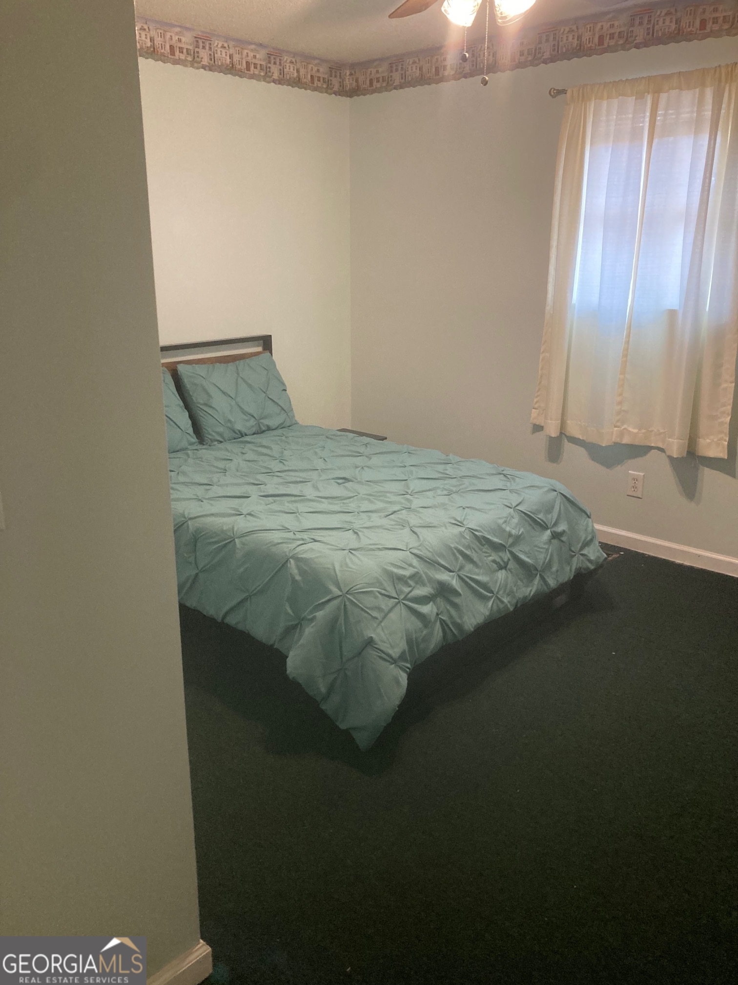 5159 Buchanan Highway Buchanan, GA 30113 - Photo 11 of 11 a bedroom with a bed and a window