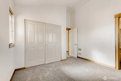 an empty room with closet area