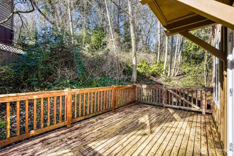 a view of balcony with wooden floor