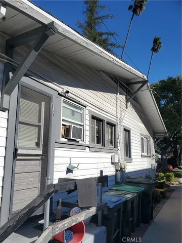 a backyard of a house with outdoor seating