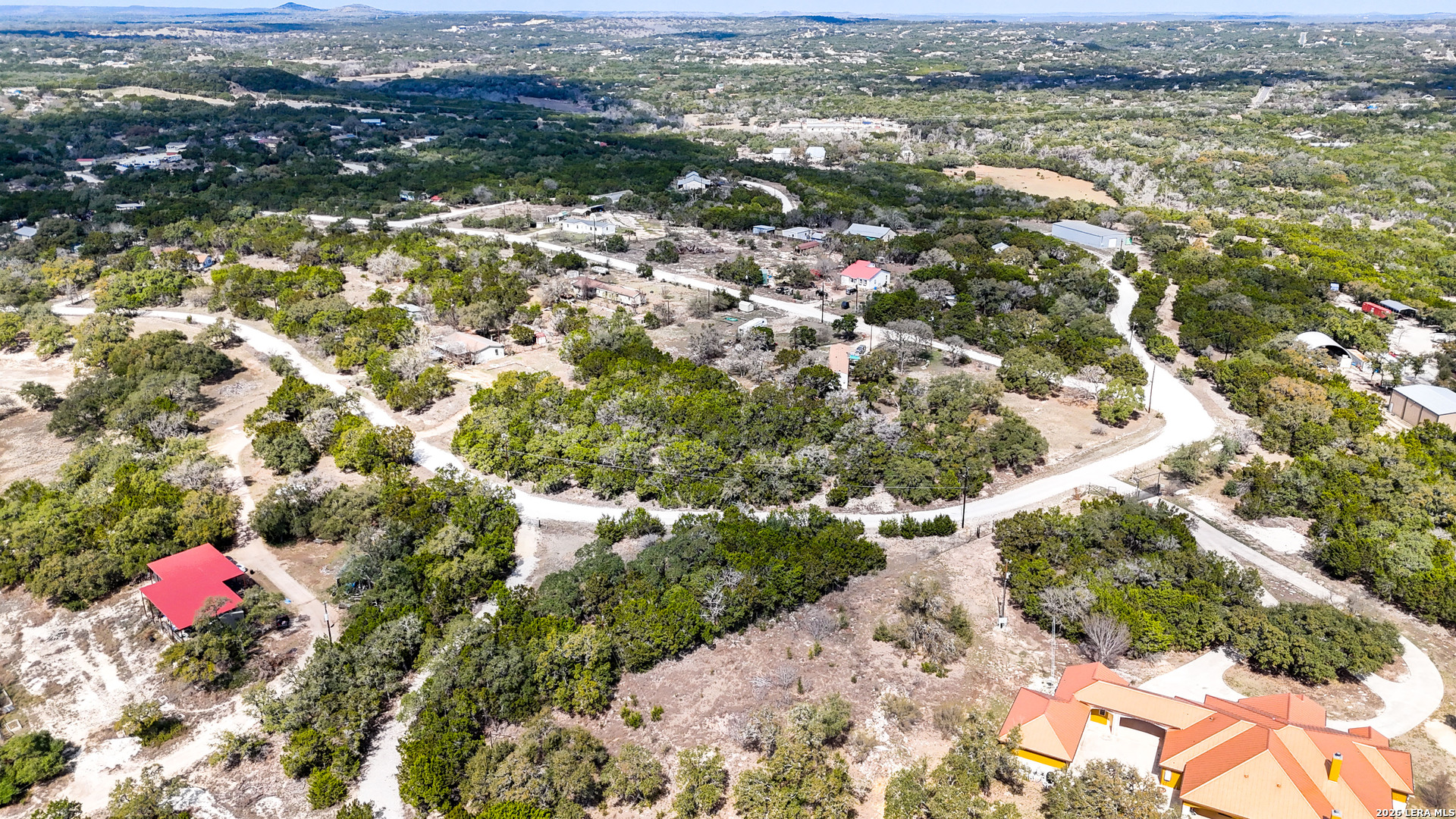 2825 Rimrock Drive Spring Branch, TX 78070 - Photo 12 of 32 an aerial view of residential houses with outdoor space and trees
