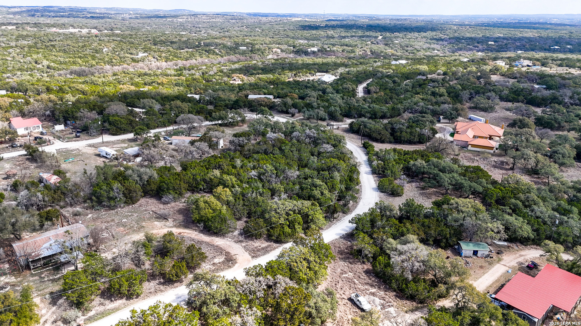 2825 Rimrock Drive Spring Branch, TX 78070 - Photo 23 of 32 an aerial view of residential houses with outdoor space and trees