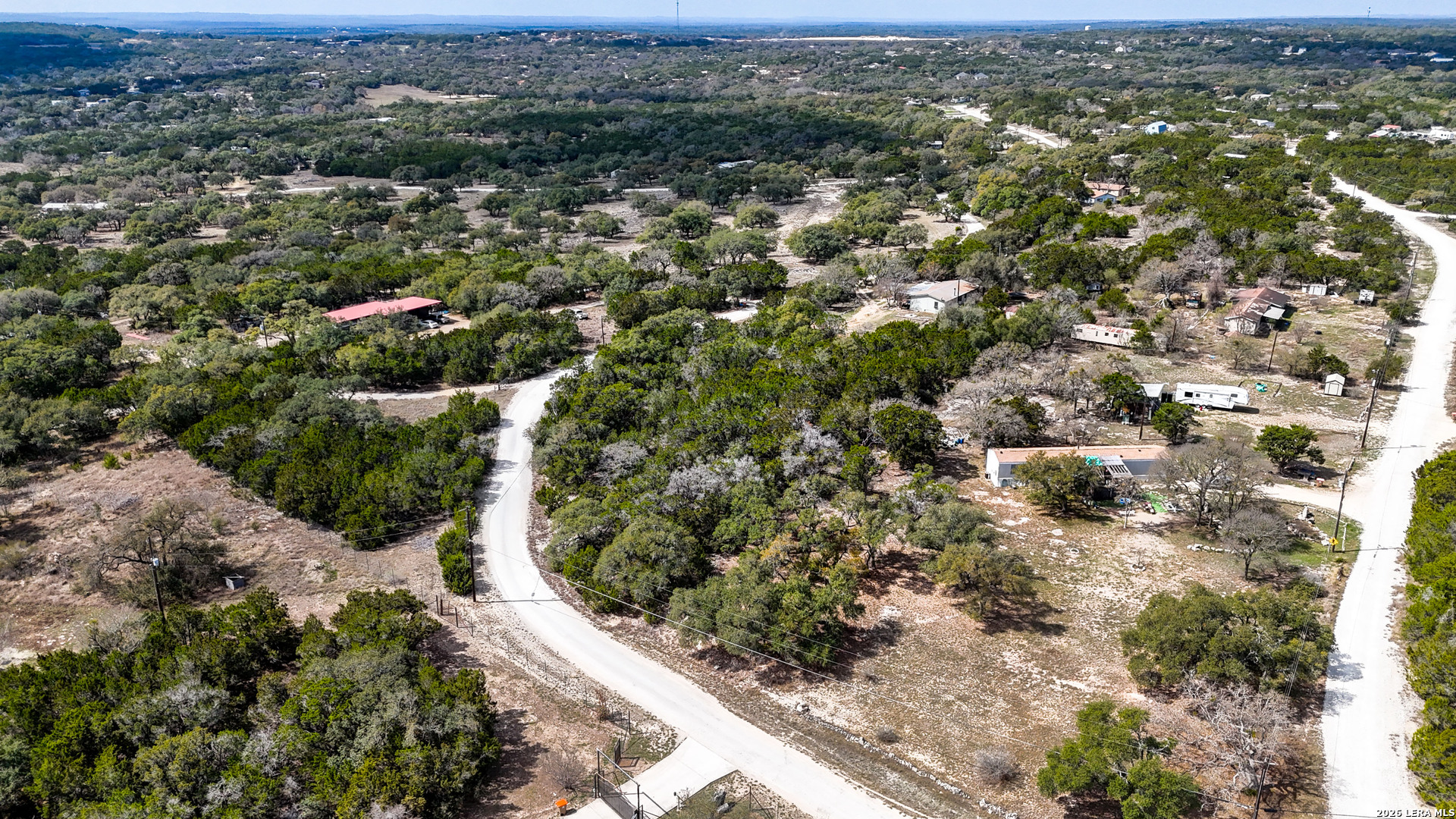 2825 Rimrock Drive Spring Branch, TX 78070 - Photo 26 of 32 an aerial view of residential houses with city and outdoor space