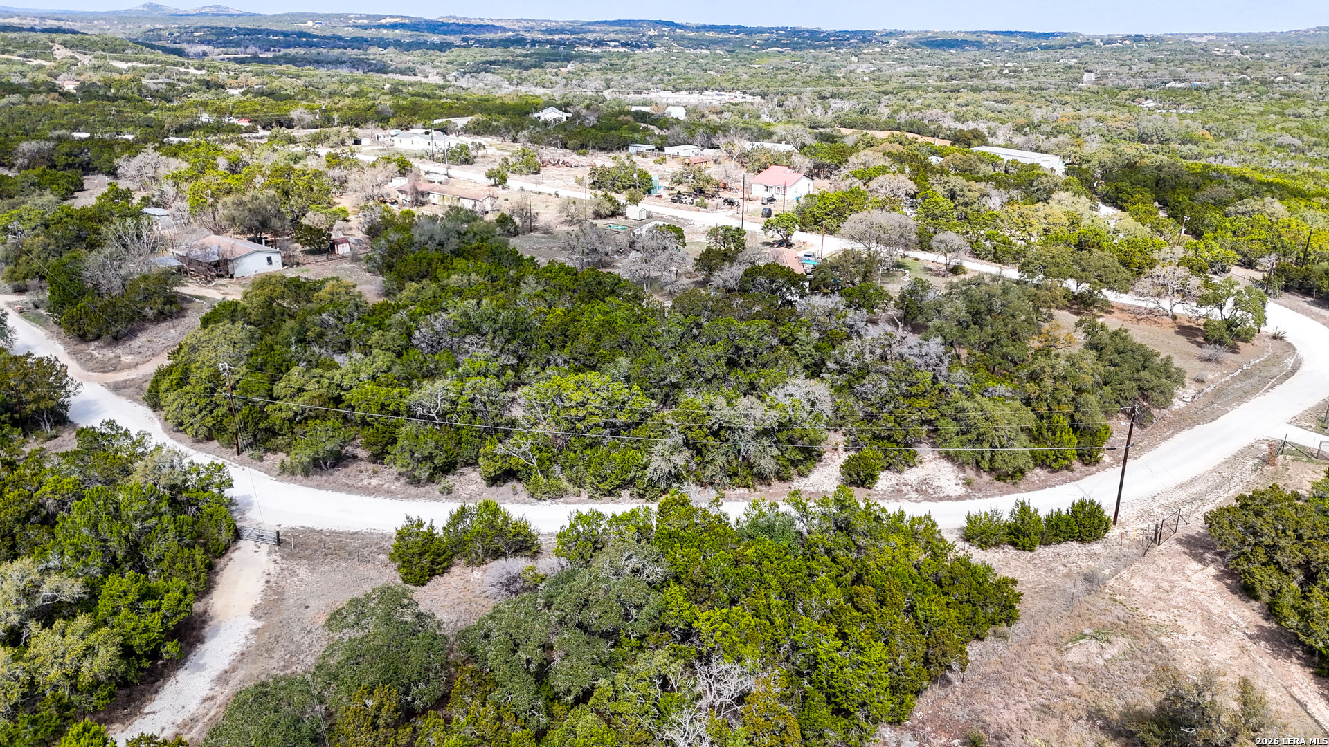2825 Rimrock Drive Spring Branch, TX 78070 - Photo 29 of 32 a view of a yard with an outdoor space
