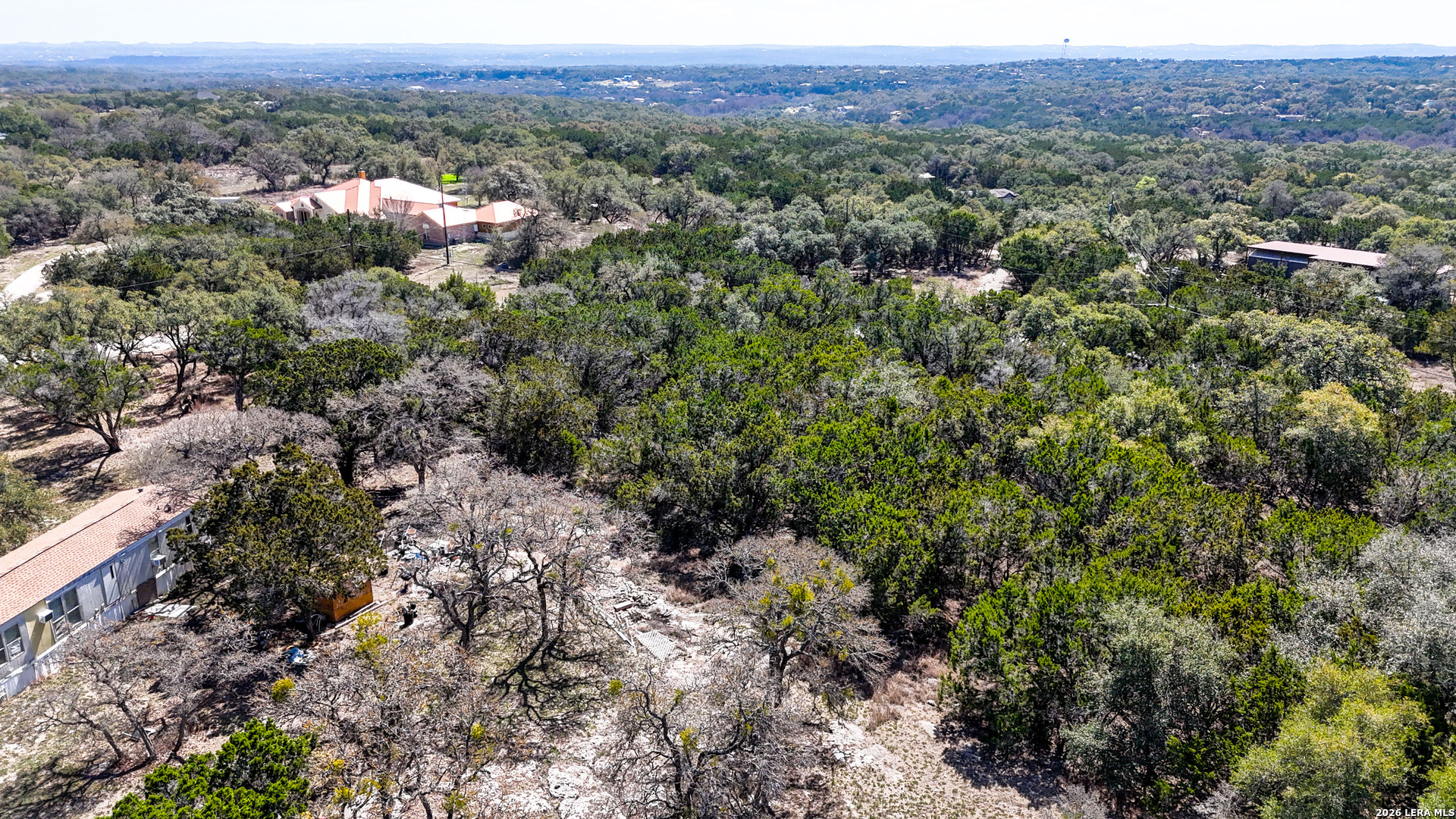 2825 Rimrock Drive Spring Branch, TX 78070 - Photo 5 of 32 a view of a city with lush green forest