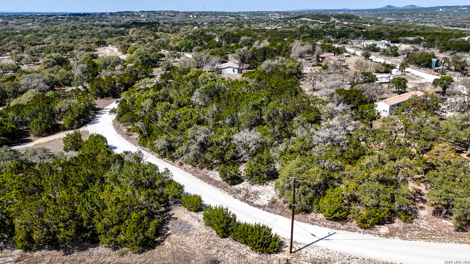 2825 Rimrock Drive Spring Branch, TX 78070 - Photo 7 of 32 a view of a city with lush green forest