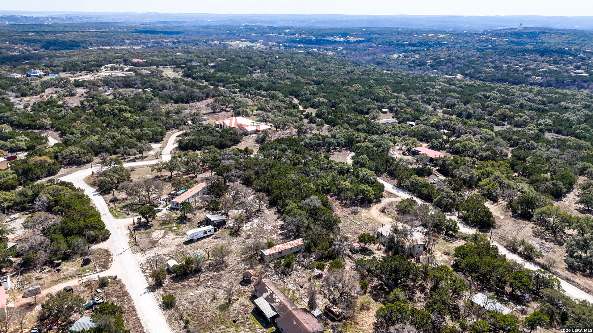2825 Rimrock Drive Spring Branch, TX 78070 - Photo 8 of 32 an aerial view of house with yard and mountain view in back