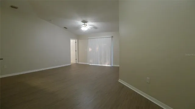 an empty room with a empty space and a window