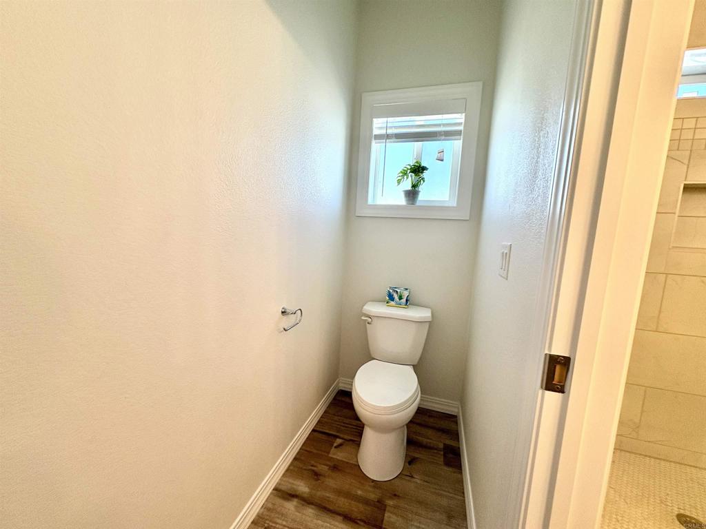 28890 Lilac Road, Unit 179 Valley Center, CA 92082 - Photo 12 of 21 a bathroom with a toilet and a sink