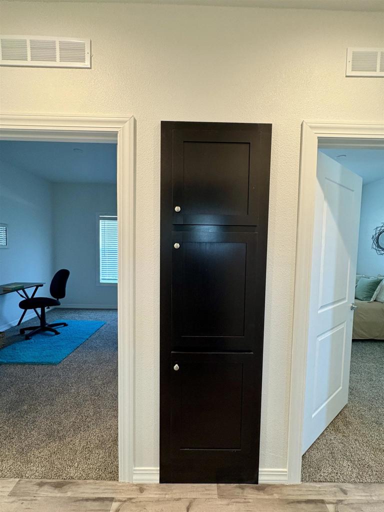 28890 Lilac Road, Unit 179 Valley Center, CA 92082 - Photo 13 of 21 a view of hallway with livingroom and couch