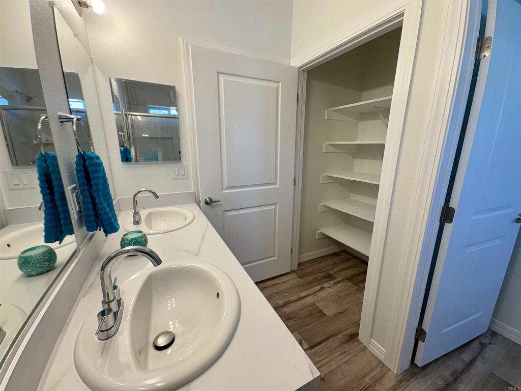 28890 Lilac Road, Unit 179 Valley Center, CA 92082 - Photo 16 of 21 a bathroom with a sink and mirror