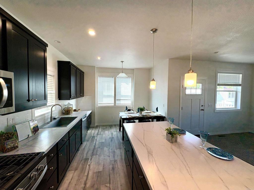 28890 Lilac Road, Unit 179 Valley Center, CA 92082 - Photo 6 of 21 a kitchen with sink stove and cabinets