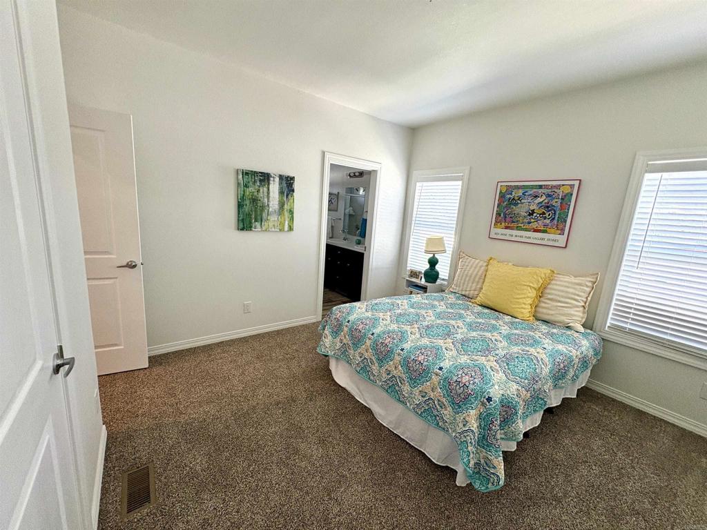 28890 Lilac Road, Unit 179 Valley Center, CA 92082 - Photo 8 of 21 a bedroom with a bed and window