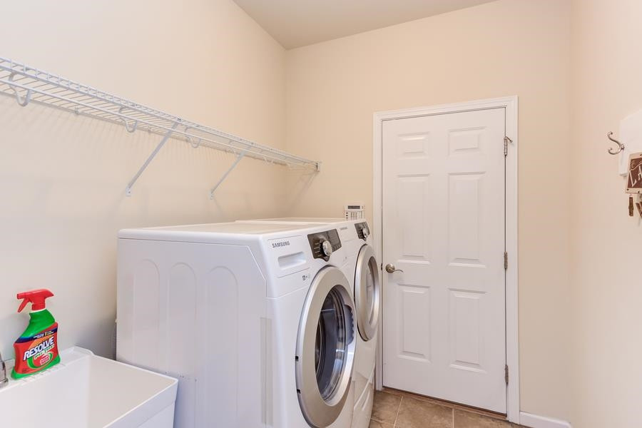 8612 Lasilla Way Raleigh, NC 27616 - Photo 18 of 27 Lovingly maintained and meticulous cared for, even the utility room is well planned with a utility sink, and is discreetly tucked in by the garage. Utility Room