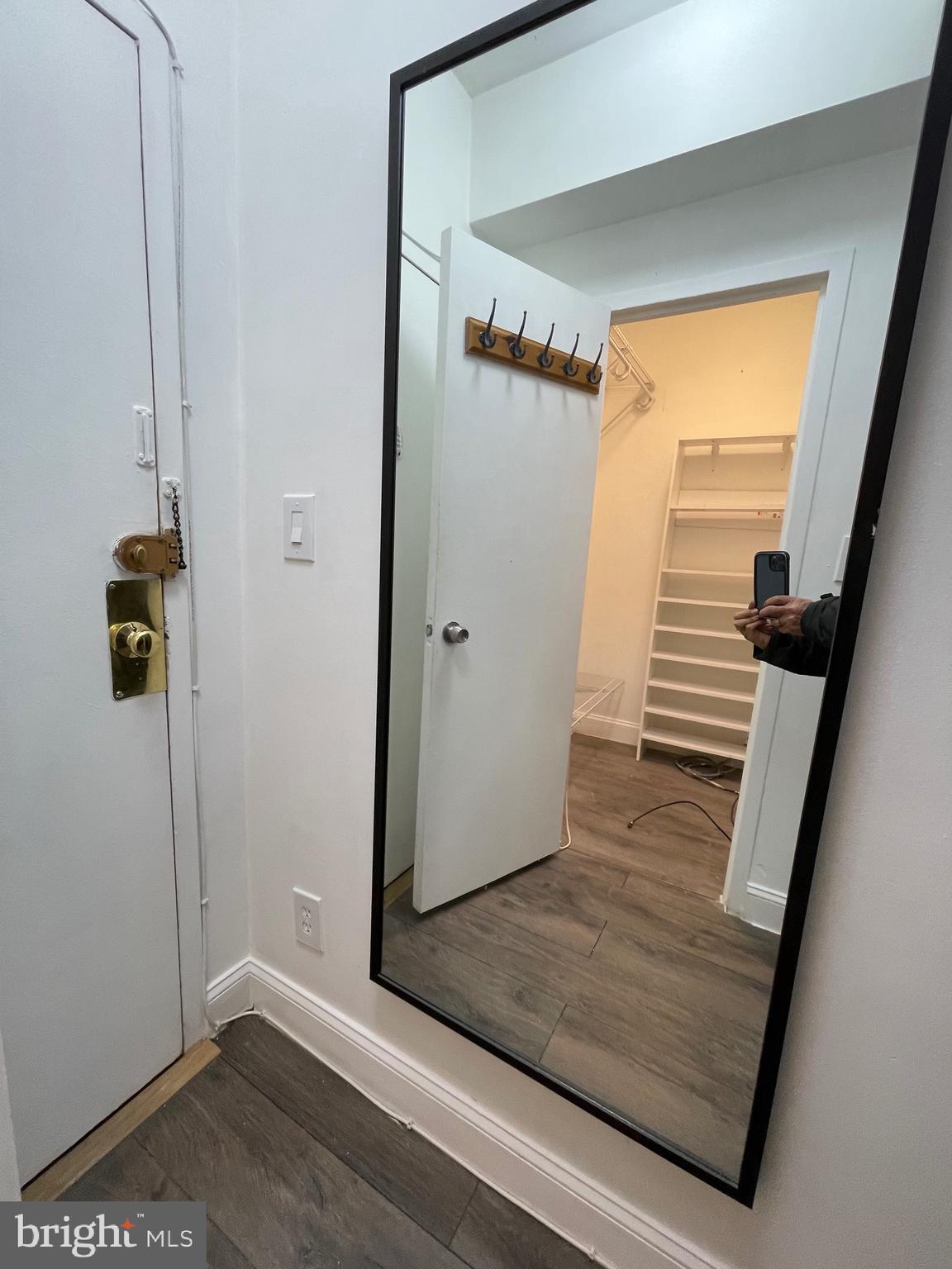 1 Scott Circle Northwest, Unit 118 Washington, DC 20036 - Photo 6 of 35 a view of a hallway with wooden floor and staircase